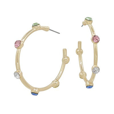 Gold hoop earrings with colorful gemstones on a white background