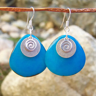 silver dangle earrings wight bright blue disc charm, and silver spiral charms