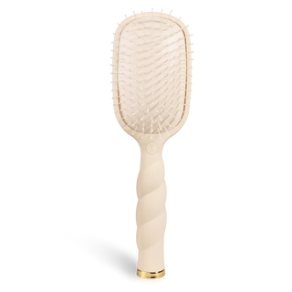Beige paddle hairbrush on a white background