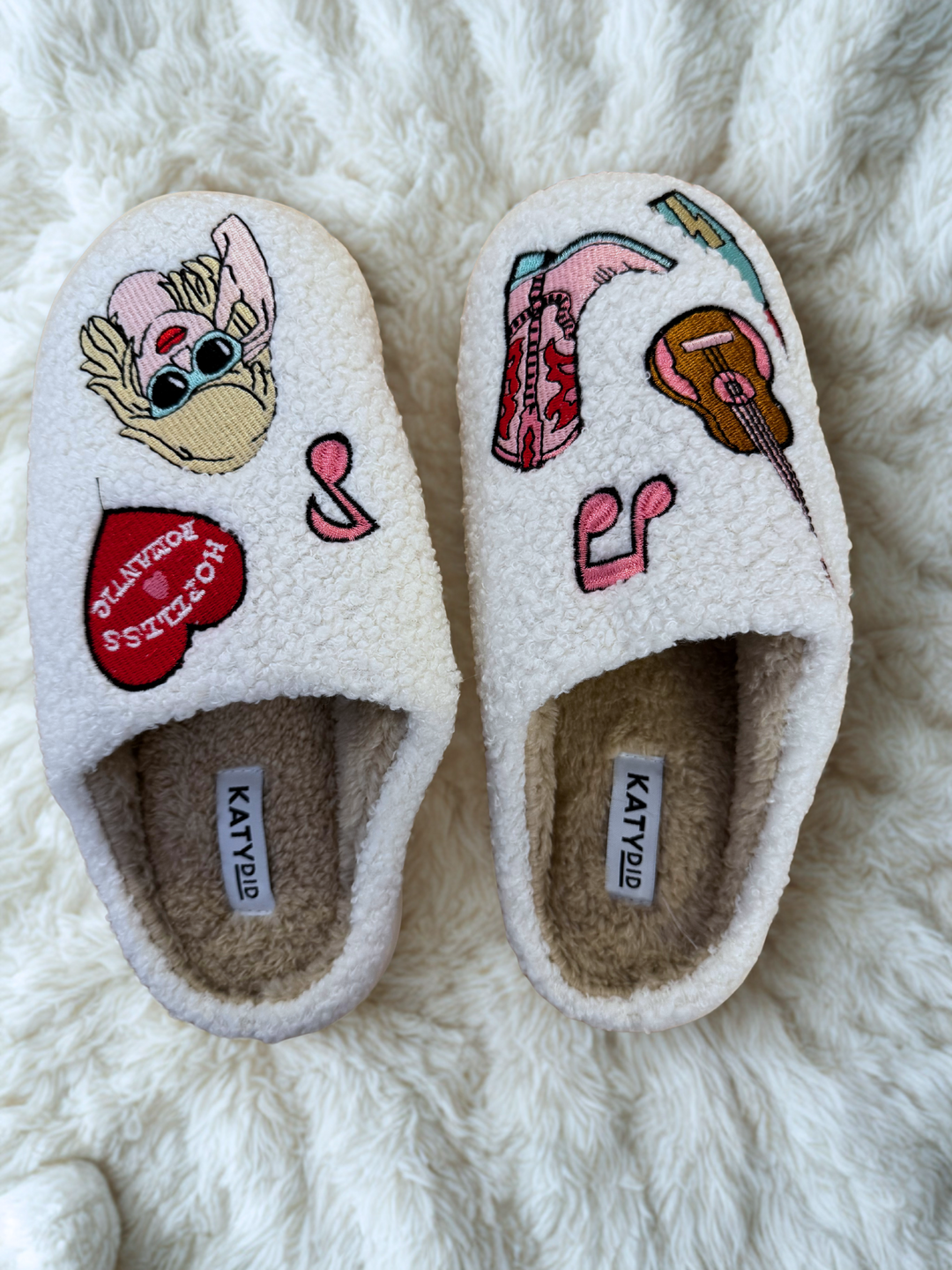 white sherpa slippers with music girl icons