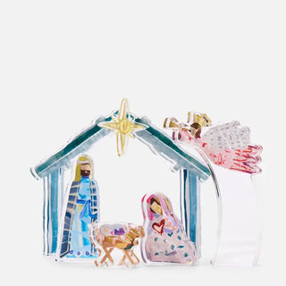 Decorative nativity scene with Mary, Joseph, and baby Jesus in a manger on a white background.