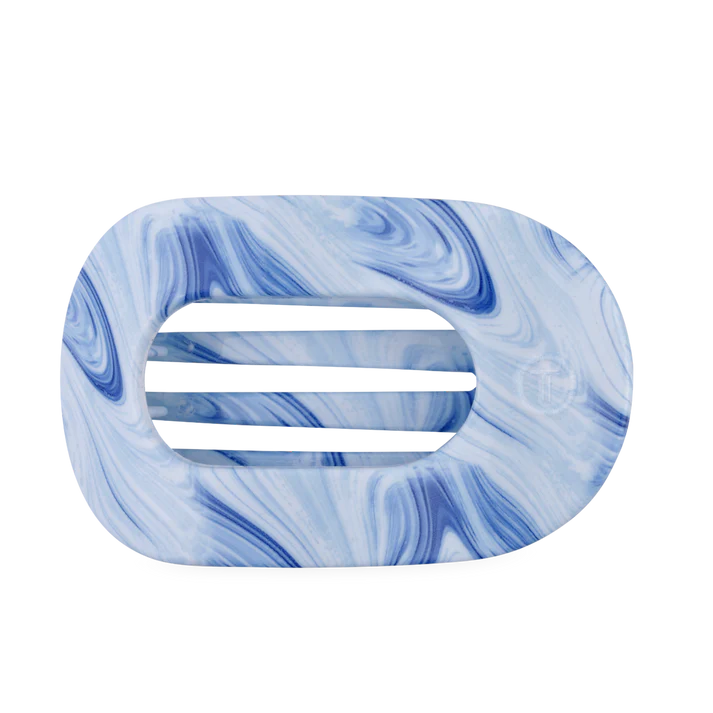 Marbled blue and white hair clip on a white background