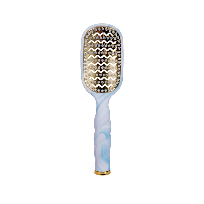 Hairbrush with decorative bristle pattern on a white background