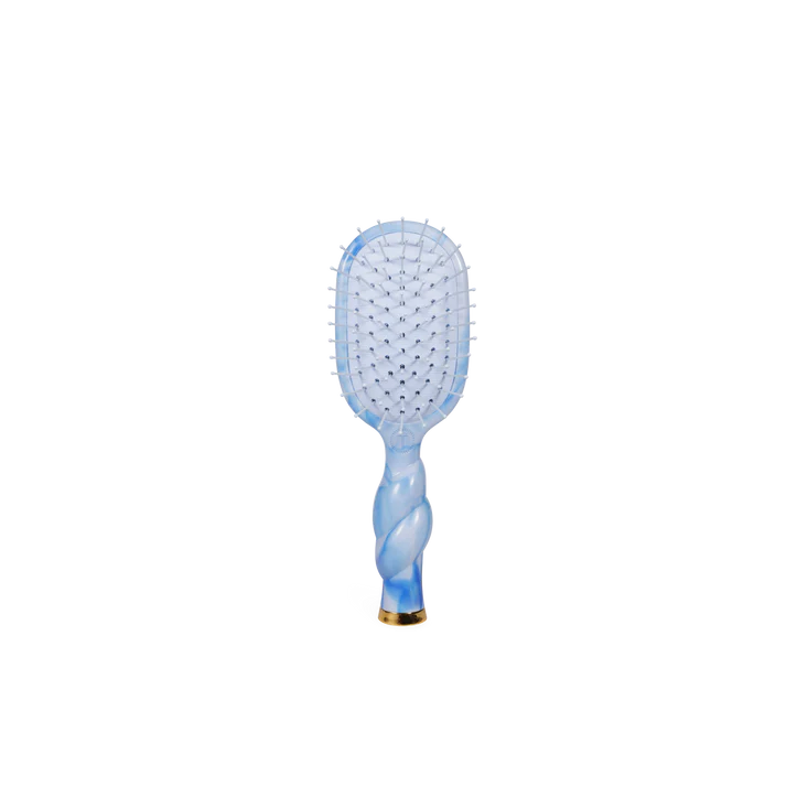 Blue paddle hairbrush on a white background