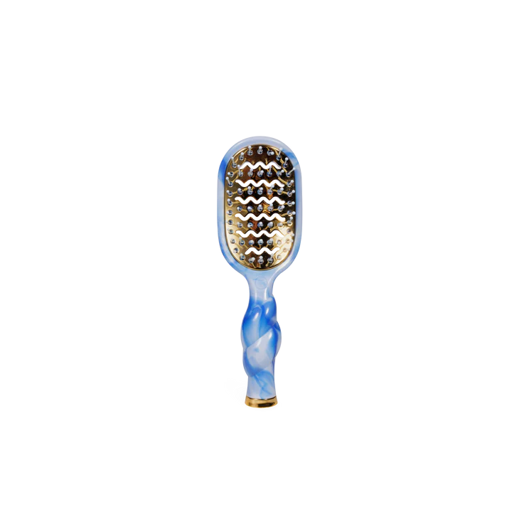 Paddle hairbrush with blue and gold design on a white background