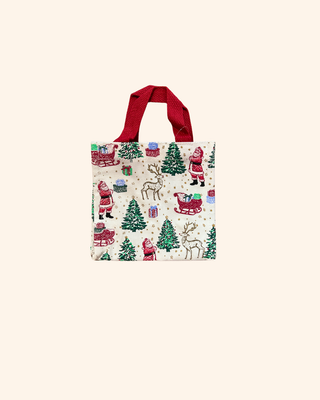 white bag  Adorned with delightful illustrations of Santa, his reindeer, and a joyful sleigh 