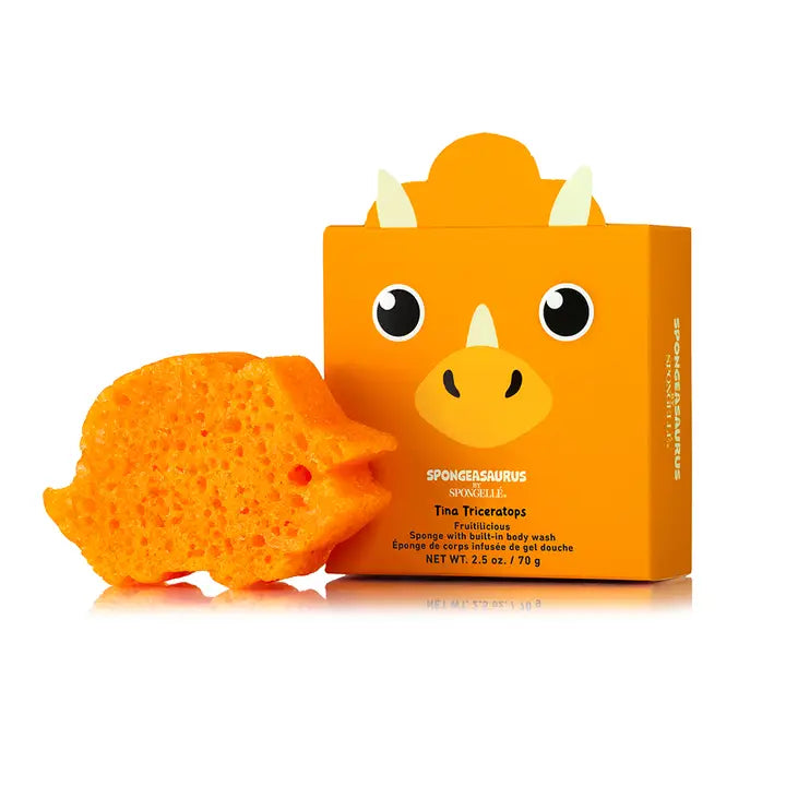 Orange dinosaur-shaped sponge with packaging on a white background