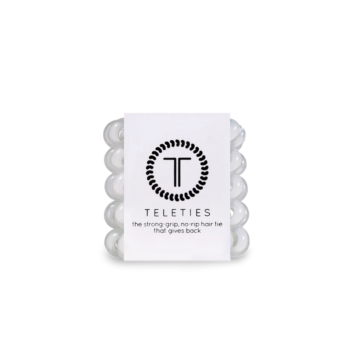 Pack of five white hair ties with the brand logo &