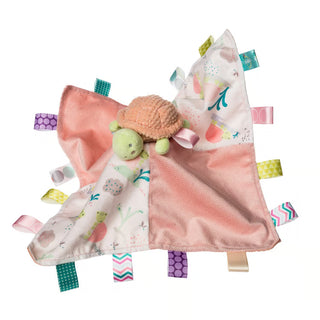 Turtle shaped plush on a Taggie Blanket