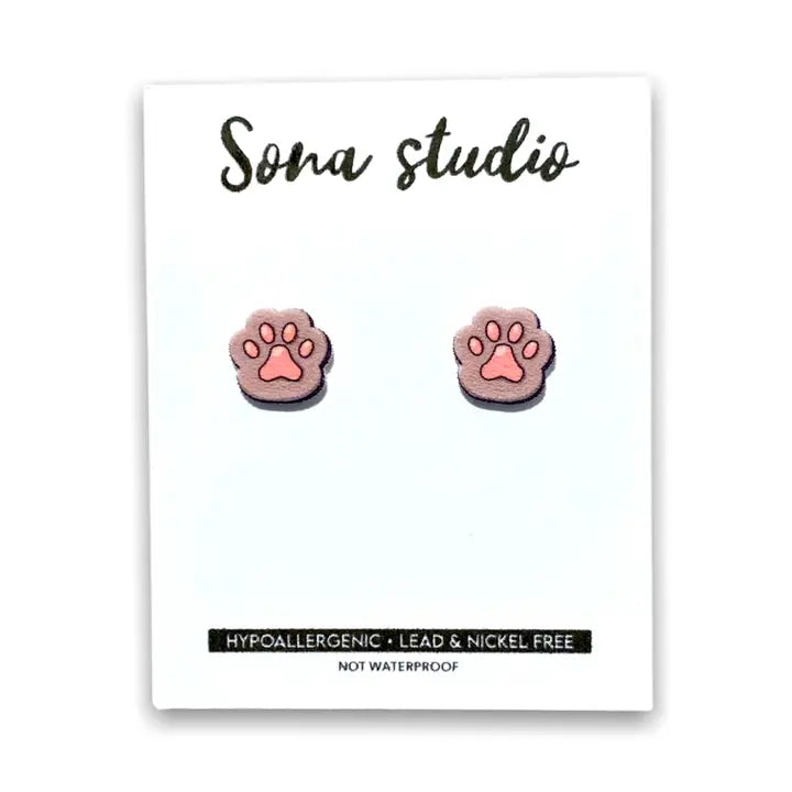 Paw print earrings on a Sona Studio branded card with product details.