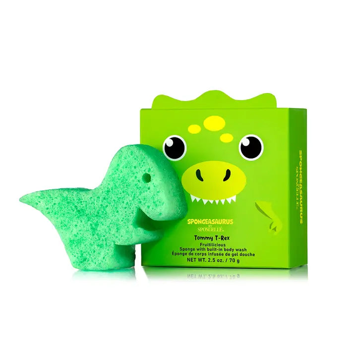 Green dinosaur-shaped bath sponge with packaging on a white background