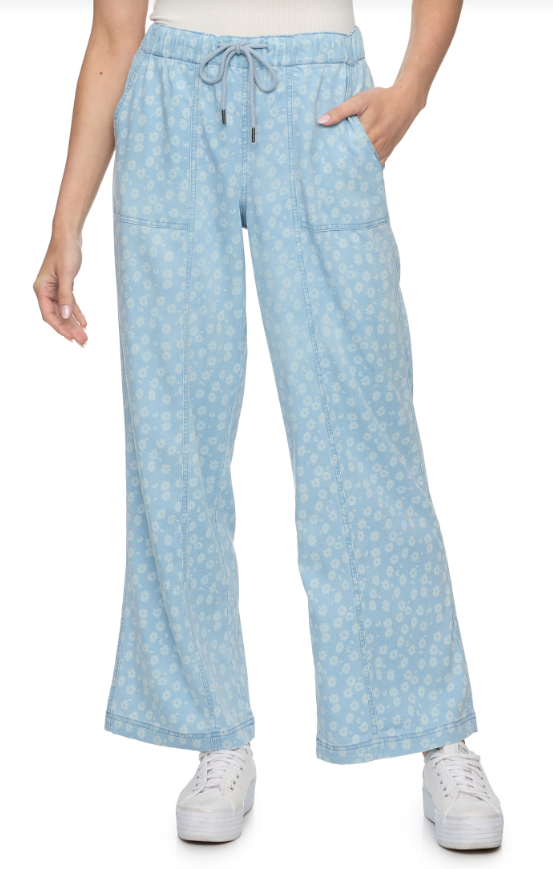 Light blue patterned pants worn by a person on a white background