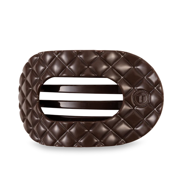 Brown quilted hair clip on a white background