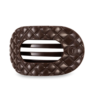 Brown quilted hair clip on a white background