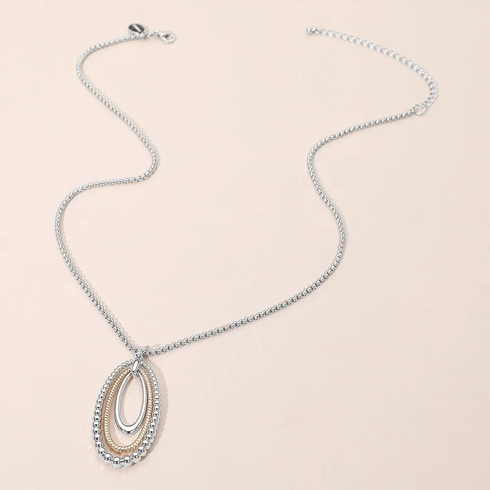 Necklace with a pendant on a beige background
