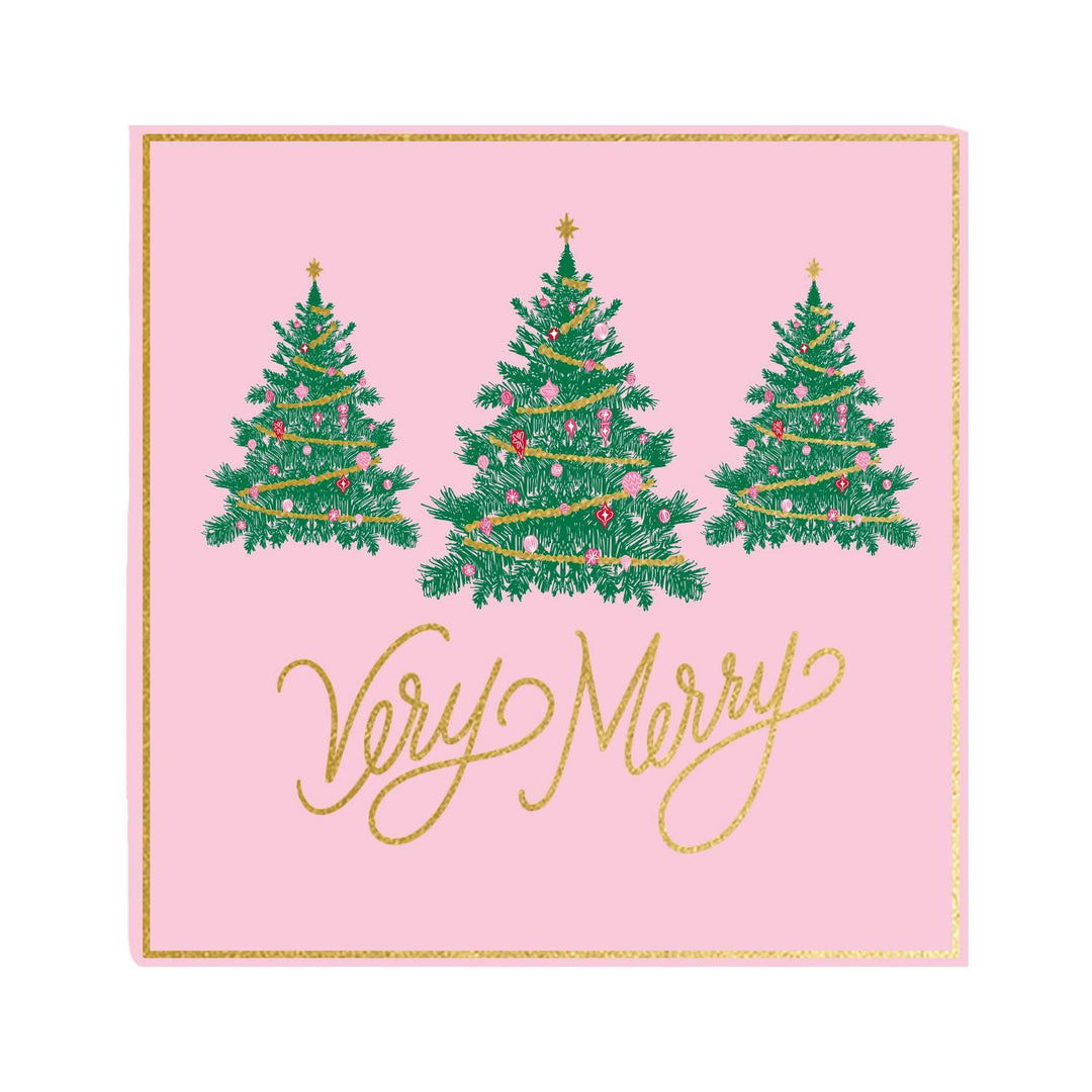 Napkin with Christmas trees and 'Very Merry' text on a pink background