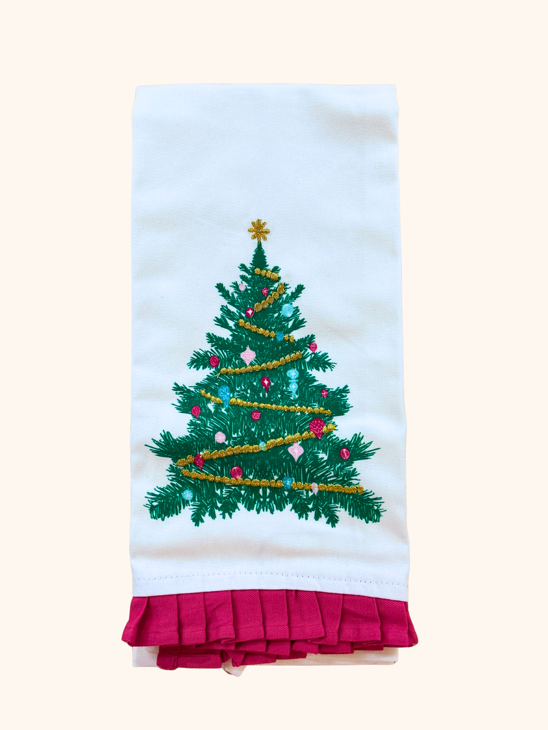 Decorative towel with a Christmas tree design on a white background