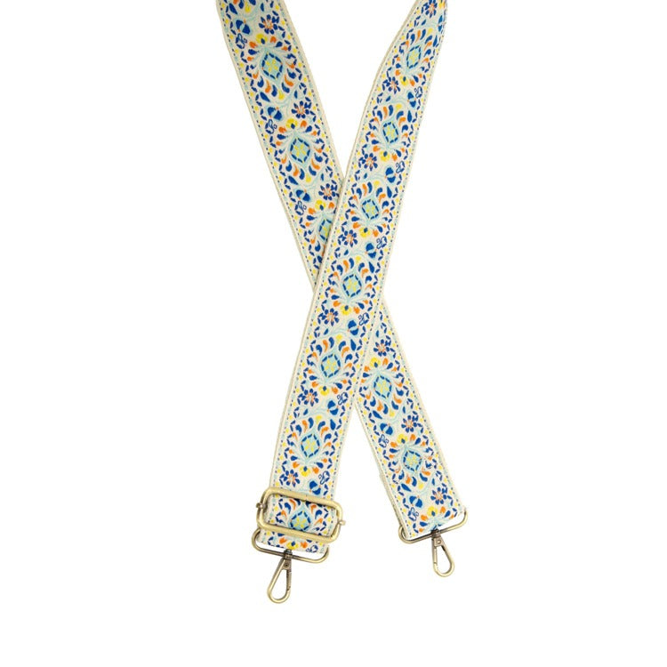 Floral patterned bag strap on a white background