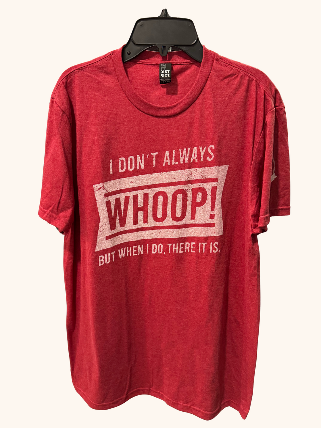 Red t-shirt with humorous text on a white background