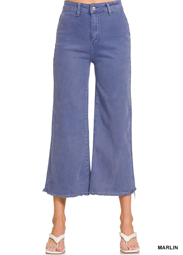 Blue denim wide-leg pants on a white background