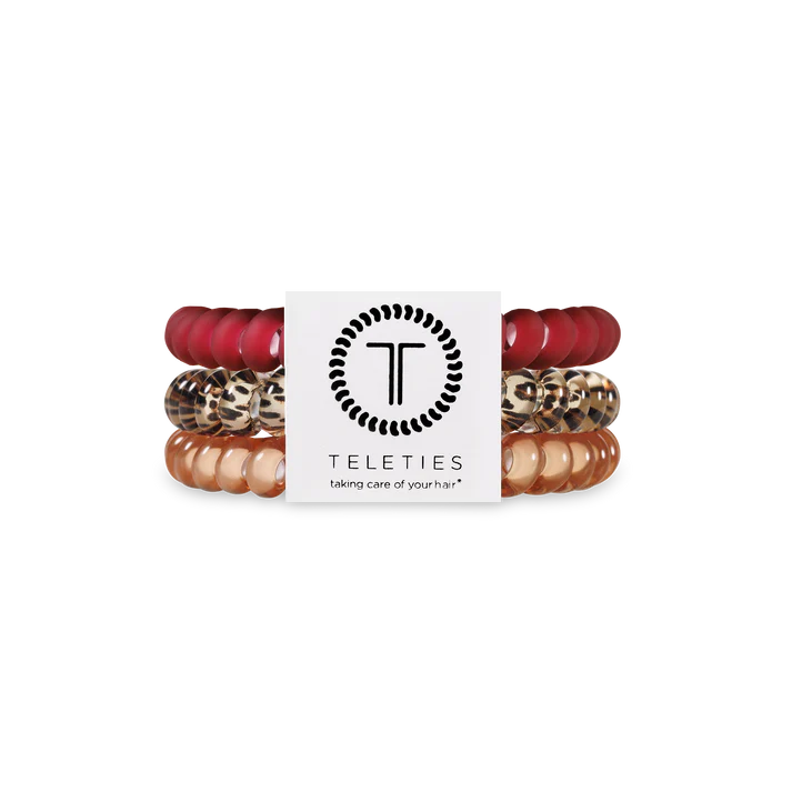 Set of hair ties with a brand label on a white background