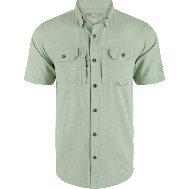 Green short-sleeve shirt with button details on a white background