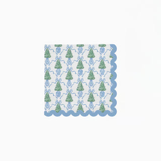 white paper napkins with blue scalloped-edges, adorned with festive Christmas trees nestled in classic blue vases and tied with cheerful bows.