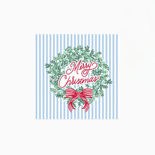 blue ands white striped napkin with green wreath, red bow, and merry christmas in red cursive