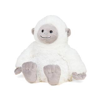white fluffy yeti plush toy against a white background