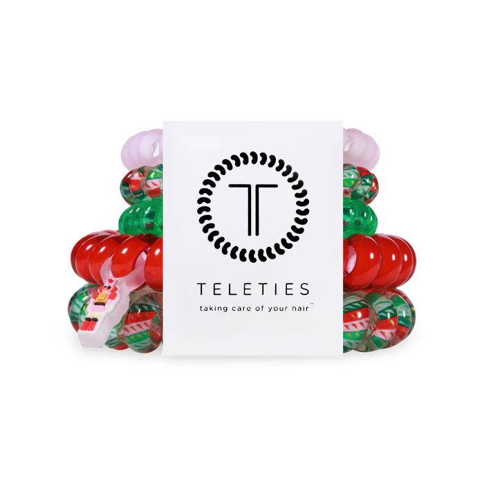 Set of colorful hair ties with a Teleties branded box on a white background