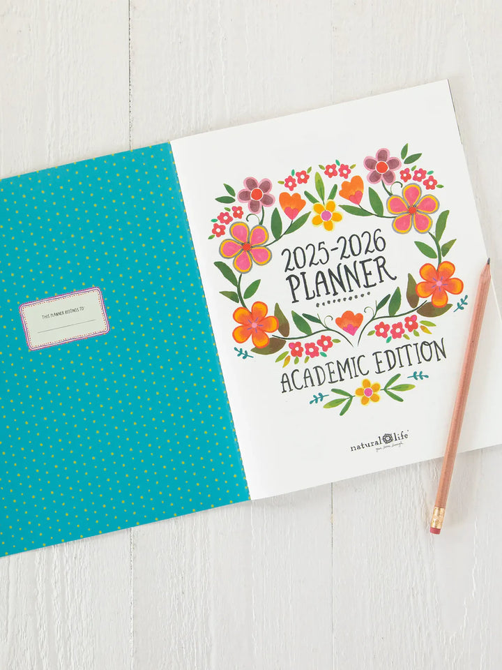 2025-2026 planner with floral design on a white surface