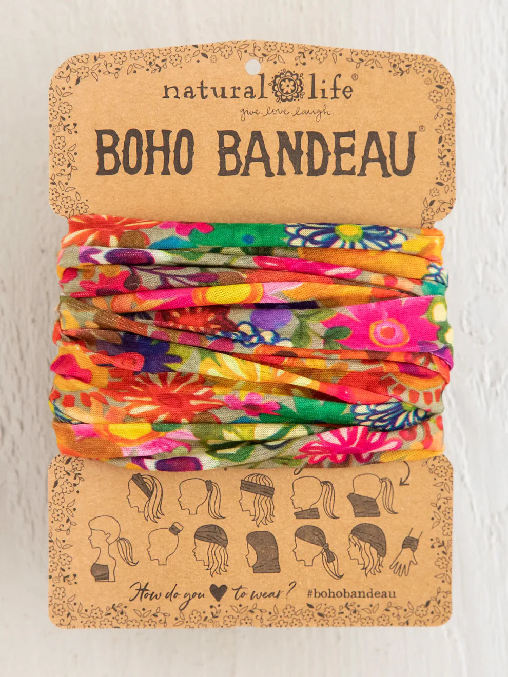 Colorful boho bandeau on a branded card with 'natural life' branding.