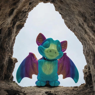 Colorful bat toy standing in a natural rock formation