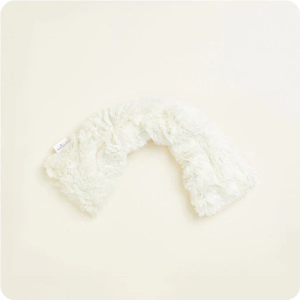 White fluffy headband on a light beige background