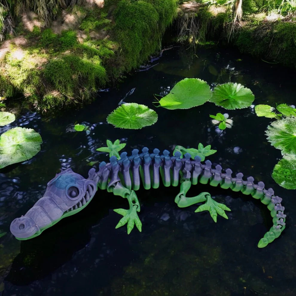 Toy alligator skeleton with green leaves on a pond