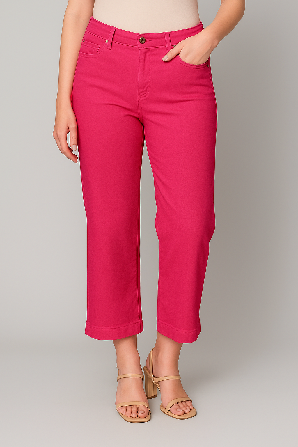 Person wearing bright pink pants on a plain background