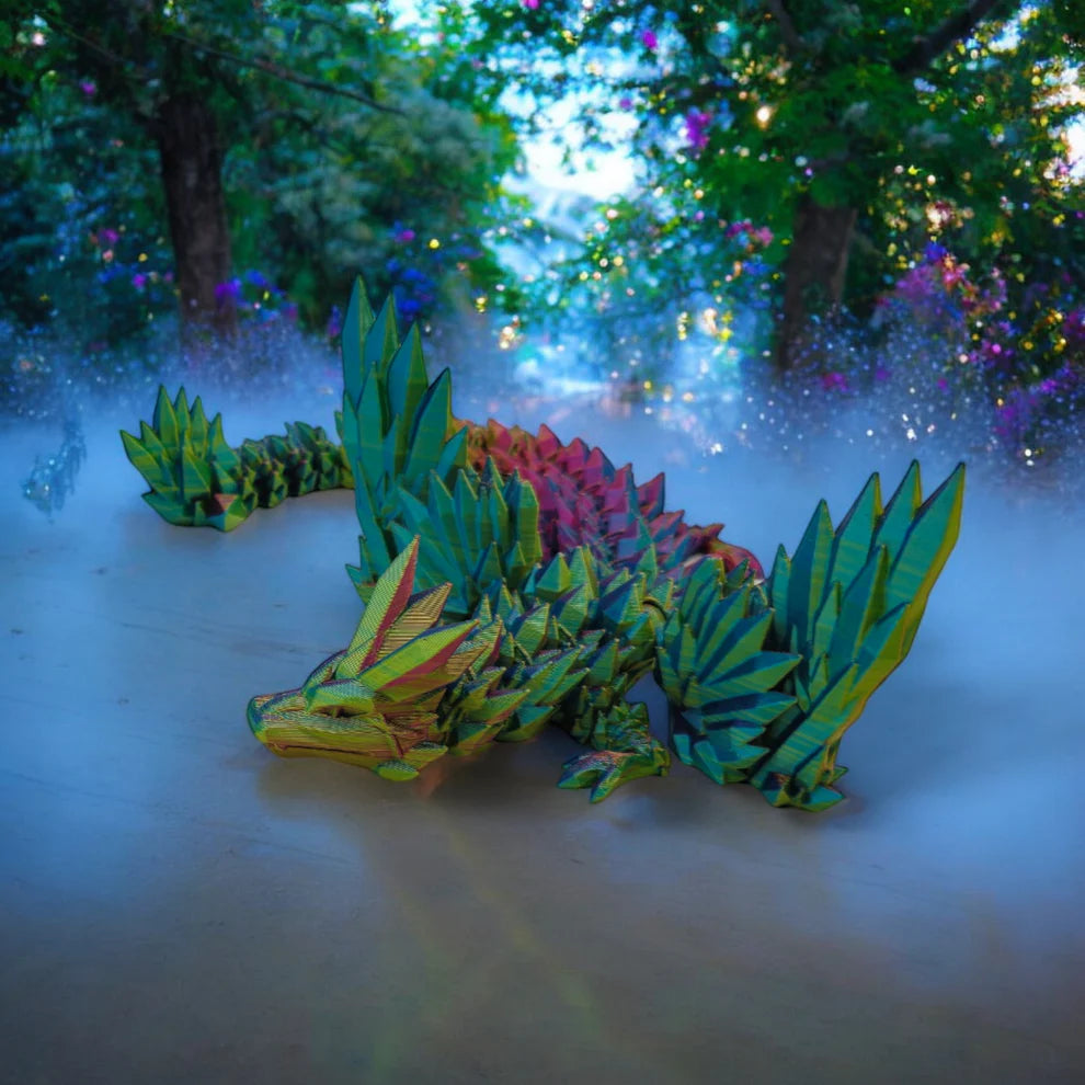 Colorful dragon-shaped toy on a foggy forest floor with blurred trees and lights in the background.