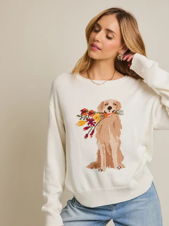 white knit sweater with golden retriever holding fall colored flowers graphic