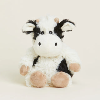 A plush toy resembling a cow with a predominantly white and black color scheme, designed for warmth and comfort.