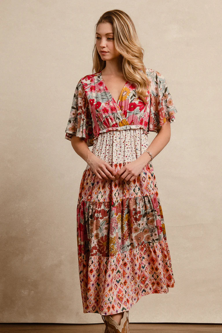 floral print midi dress with mixed print panels and a v-neckline