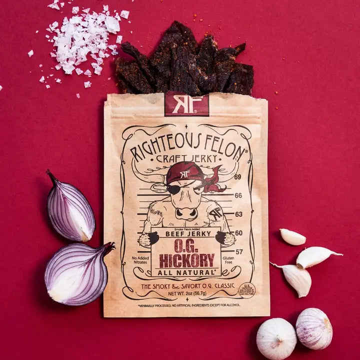 Righteous Felon craft jerky package with onions and garlic on a red background