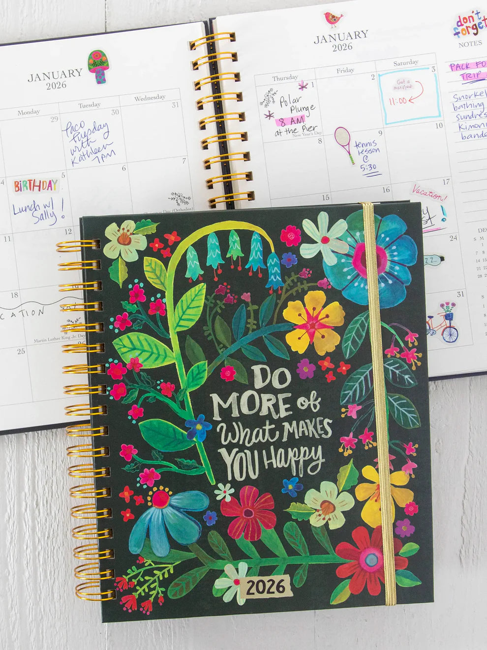2026 planner with floral design and motivational quote on a white surface