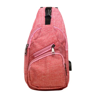 A pink NuPouch anti-theft daypack with zipper closure and a USB port on the exterior.