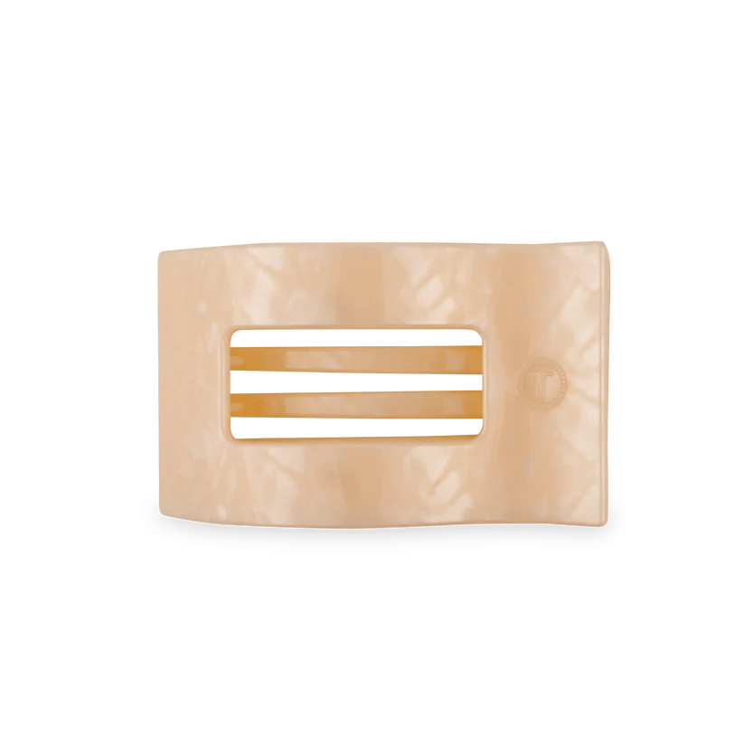 Beige hair clip with a rectangular design on a white background