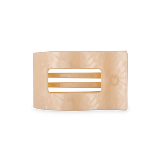 Beige hair clip with a rectangular design on a white background
