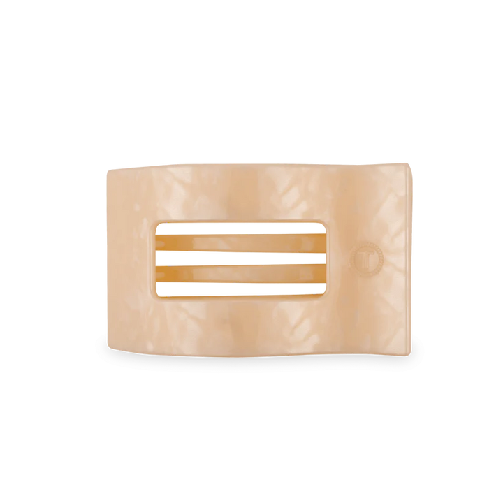 Beige hair clip with a rectangular design on a white background