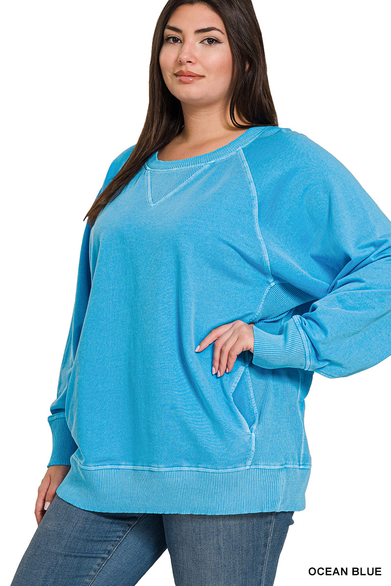 Woman wearing a blue sweatshirt on a white background