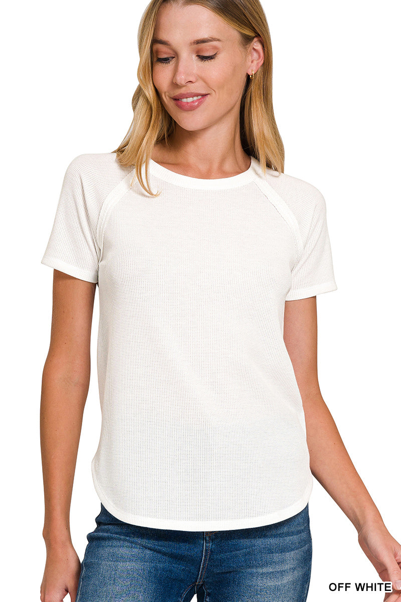 Woman wearing a plain white t-shirt on a white background